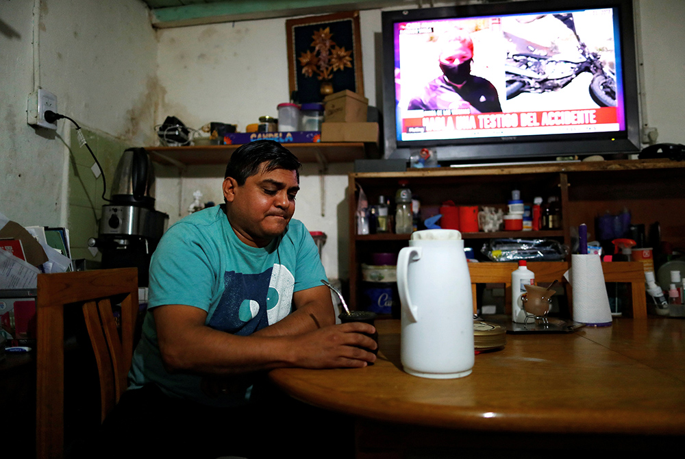 Gustavo Delgado, 52, who lost his job because of the COVID-19 pandemic, drinks a mate Dec. 15, 2020, at his home in Buenos Aires, Argentina. (CNS/Reuters/Agustin Marcarian)