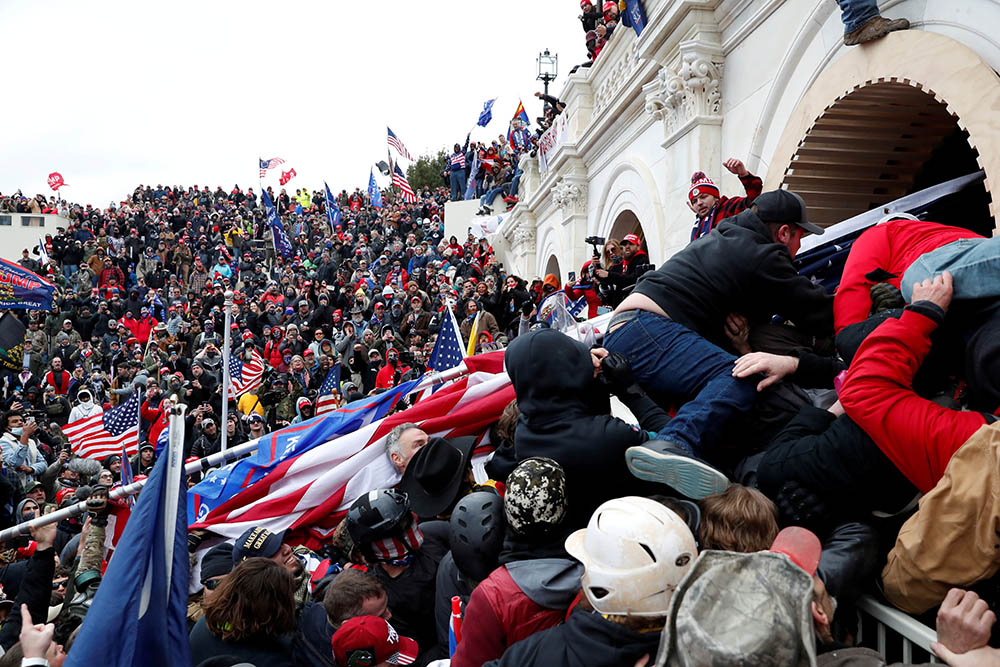 President Donald Trump supporters storm into the U.S. Capitol in Washington Jan. 6 during a rally to contest the certification of the 2020 presidential election. (CNS/Reuters/Shannon Stapleton) President Donald Trump supporters storm into the U.S. Capitol in Washington Jan. 6 during a rally to contest the certification of the 2020 presidential election. (CNS/Reuters/Shannon Stapleton)