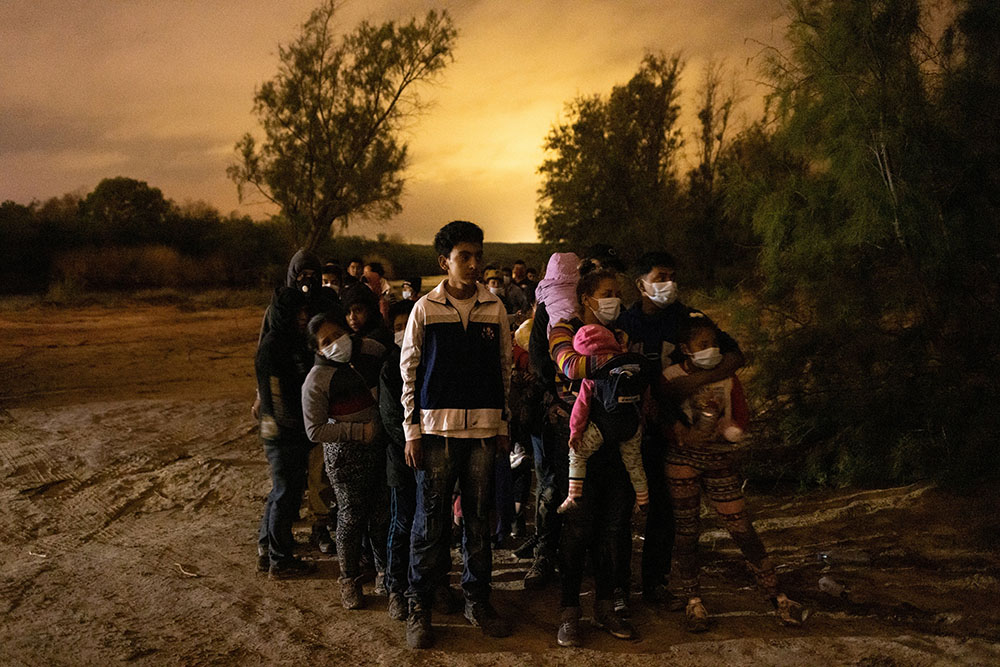 Migrants from Central America seeking asylum in the United States line up May 15 to be escorted to the main road by the Texas Army National Guard in Roma, Texas, after crossing the Rio Grande. (CNS/Reuters/Adrees Latif) Migrants from Central America seeking asylum in the United States line up May 15 to be escorted to the main road by the Texas Army National Guard in Roma, Texas, after crossing the Rio Grande. (CNS/Reuters/Adrees Latif)