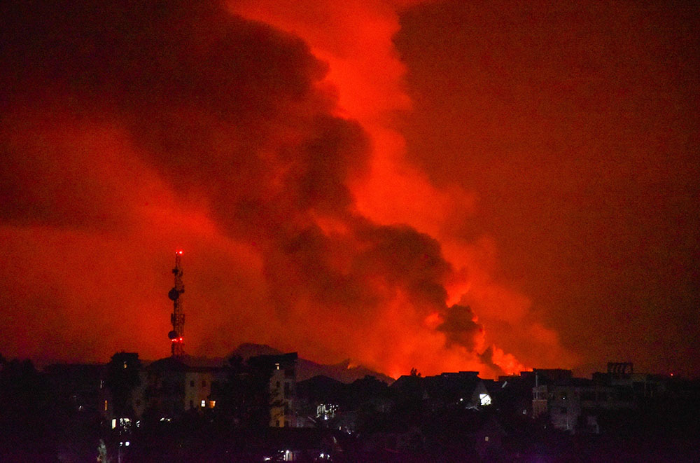 Smoke rises from the volcanic eruption of Mount Nyiragongo near Goma, Congo, May 22. (CNS/Reuters/Olivia Acland)