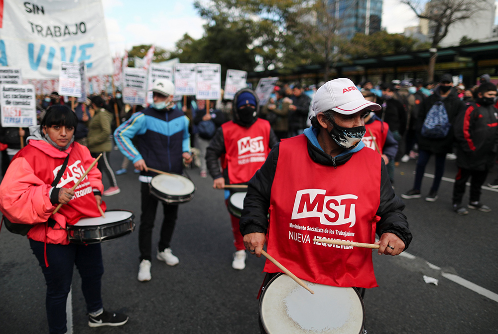 Demonstrators protest to demand better wages, COVID-19 vaccines and resources for soup kitchens June 18 in Buenos Aires, Argentina. (CNS/Reuters/Agustin Marcarian)