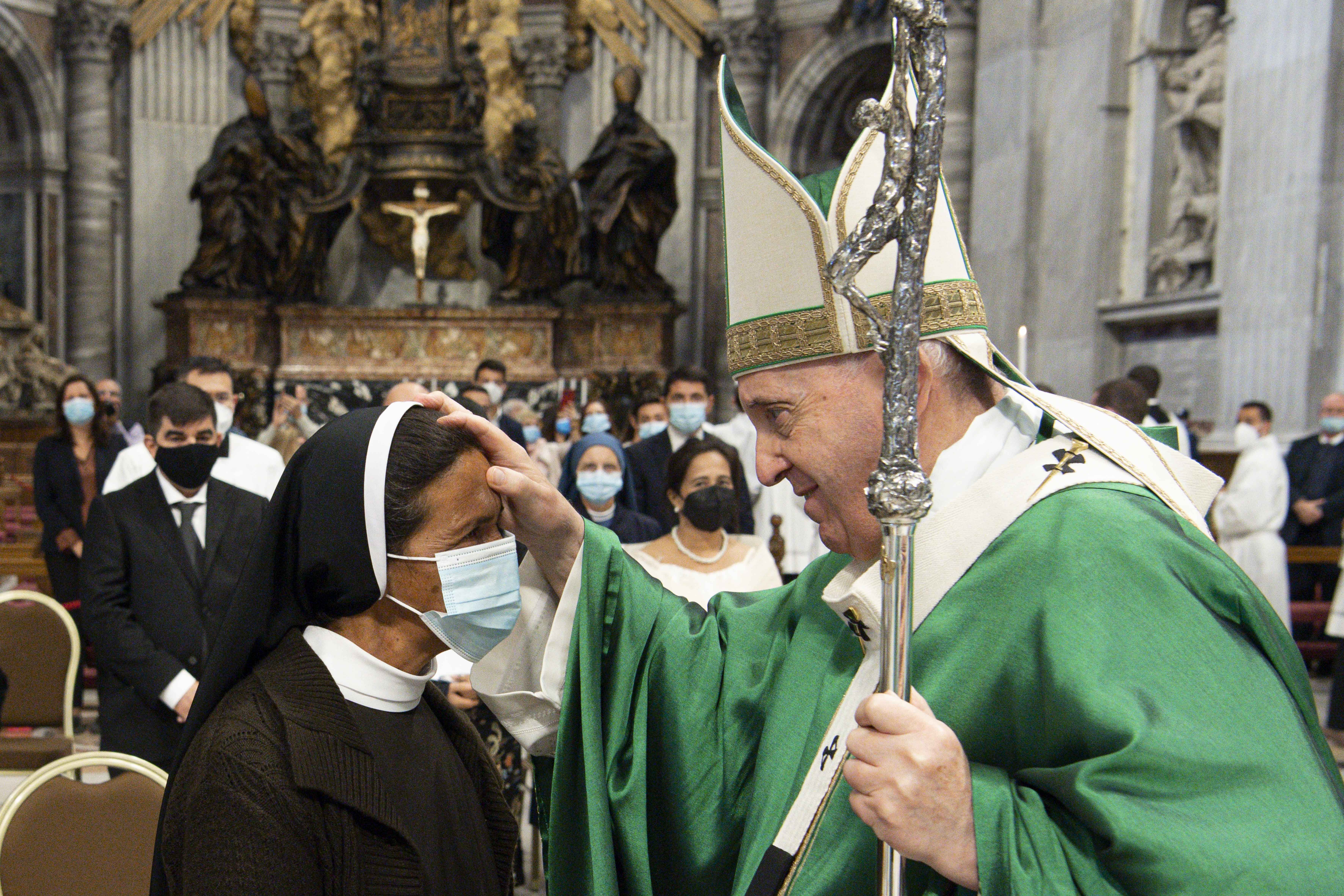 Pope Francis blesses Sister Gloria Cecilia Narváez Argot, a member of the Franciscan Sisters of Mary Immaculate, at the end of Mass in St. Peter's Basilica at the Vatican Oct. 10, 2021. The sister, a missionary from Colombia, was kidnapped in Mali in 2017