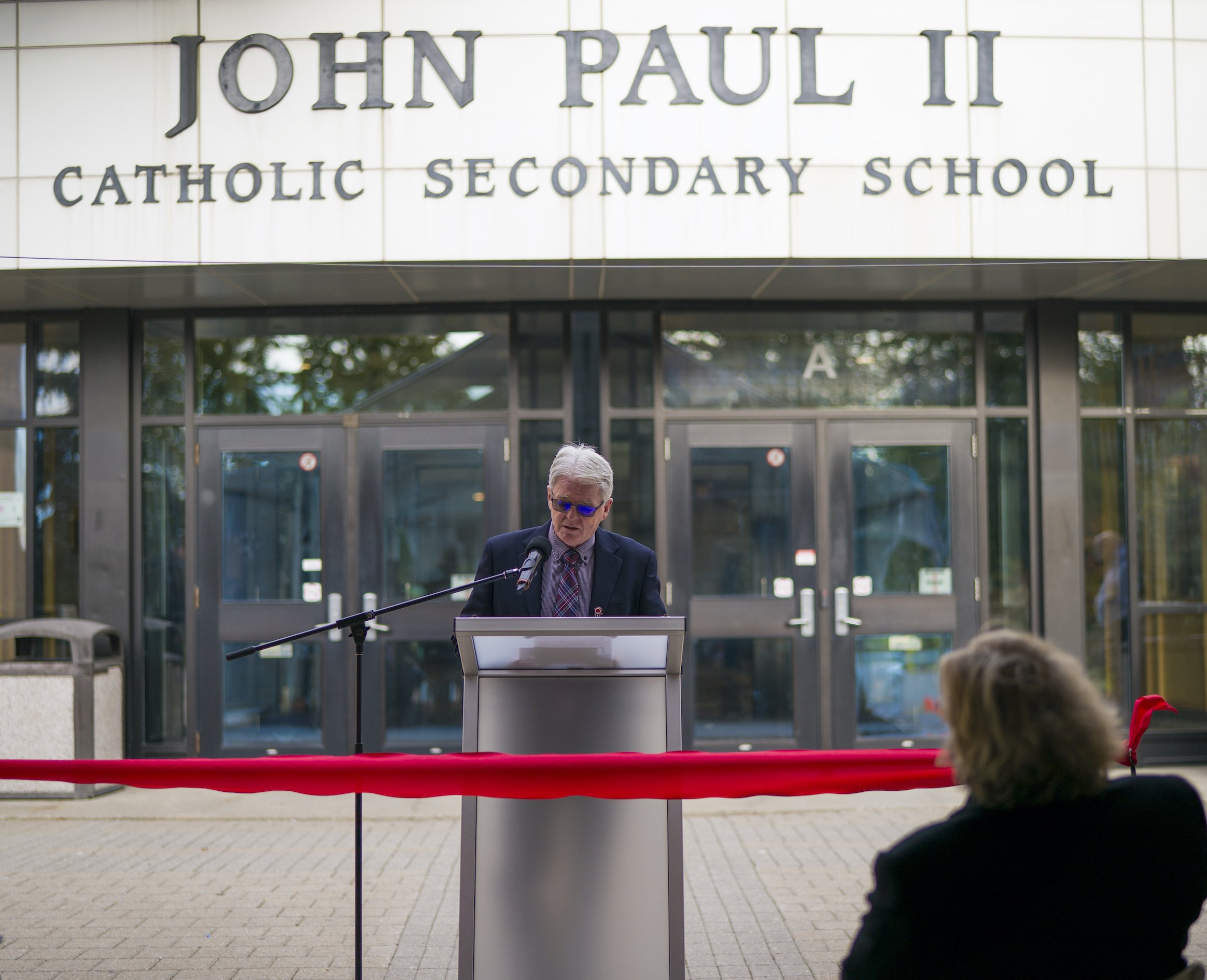 Peter Cassidy, principal at John Paul II Secondary School, speaks at the ribbon-cutting ceremony for the newly retrofitted carbon-neutral school in London, Ontario, Nov. 2. (CNS photo/courtesy Raymond Garcia, via Catholic Register)