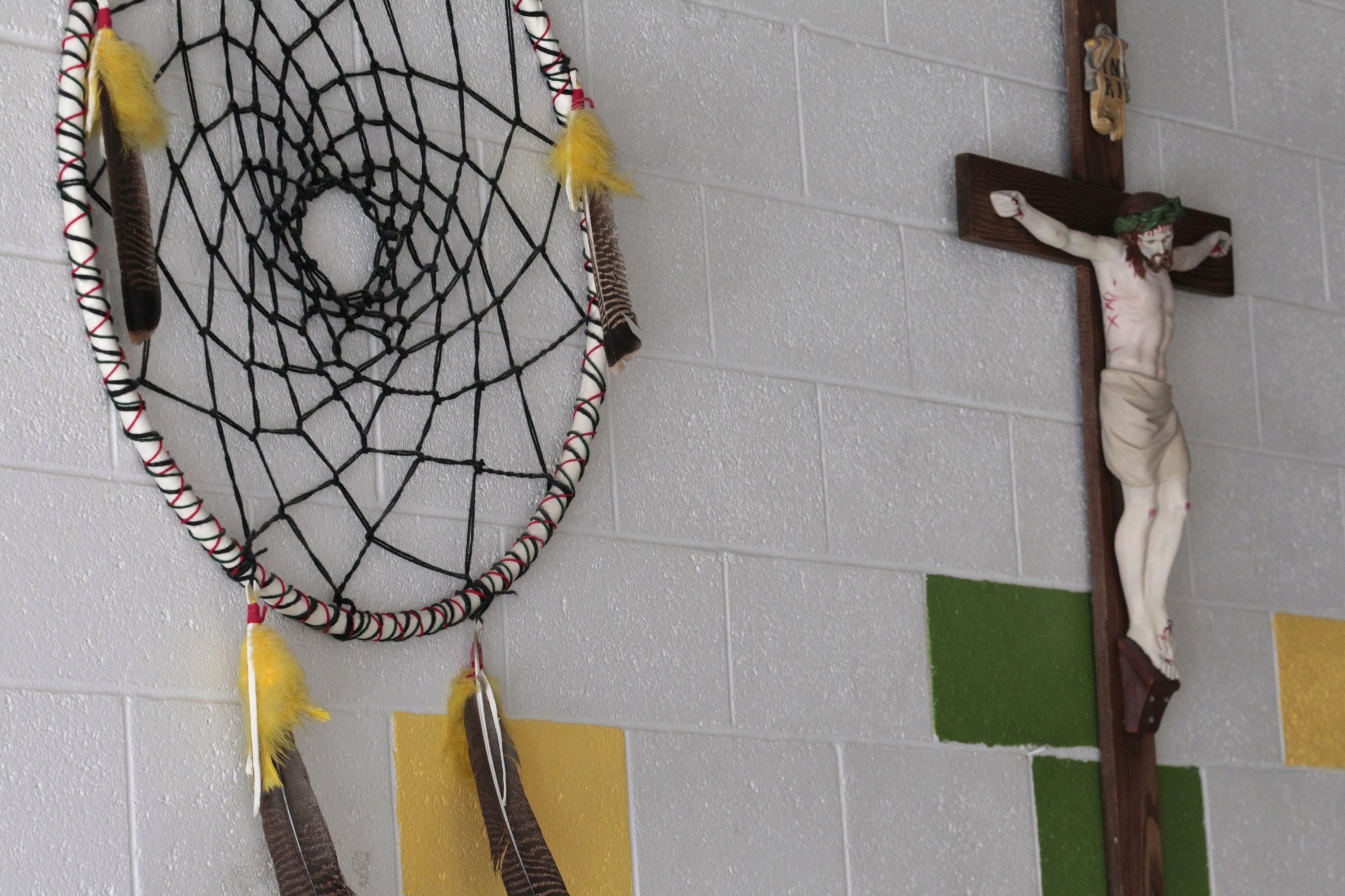 A dream catcher and crucifix are seen on the wall at St. Anthony Indian School on the Zuni Pueblo Indian reservation in New Mexico in this 2011 file photo. (CNS photo/Bob Roller)