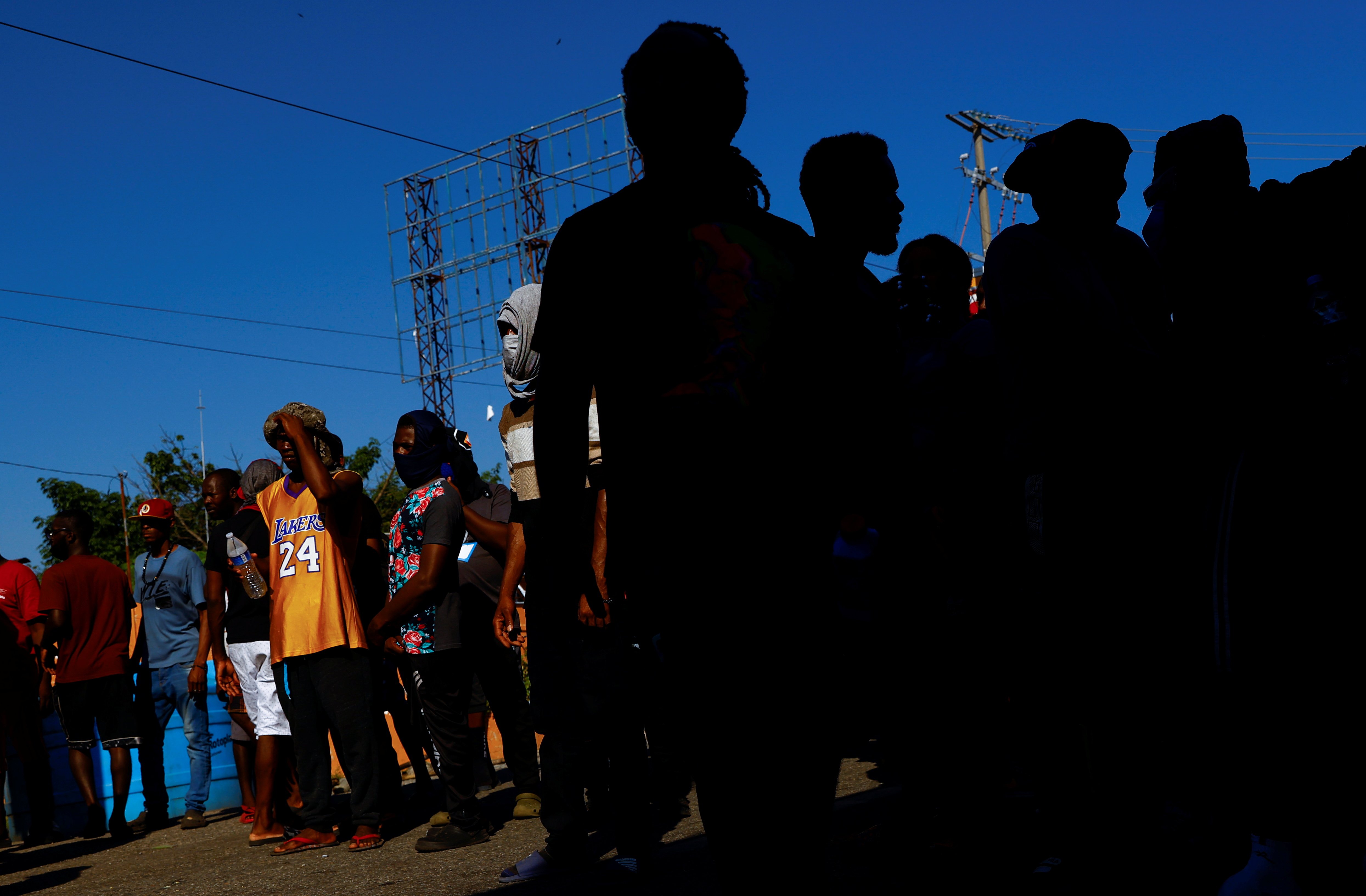 Migrants from Haiti heading to the U.S. border block a road in Huehuetán, Mexico, Nov. 30, 2021. (CNS photo/Jose Luis Gonzalez, Reuters)