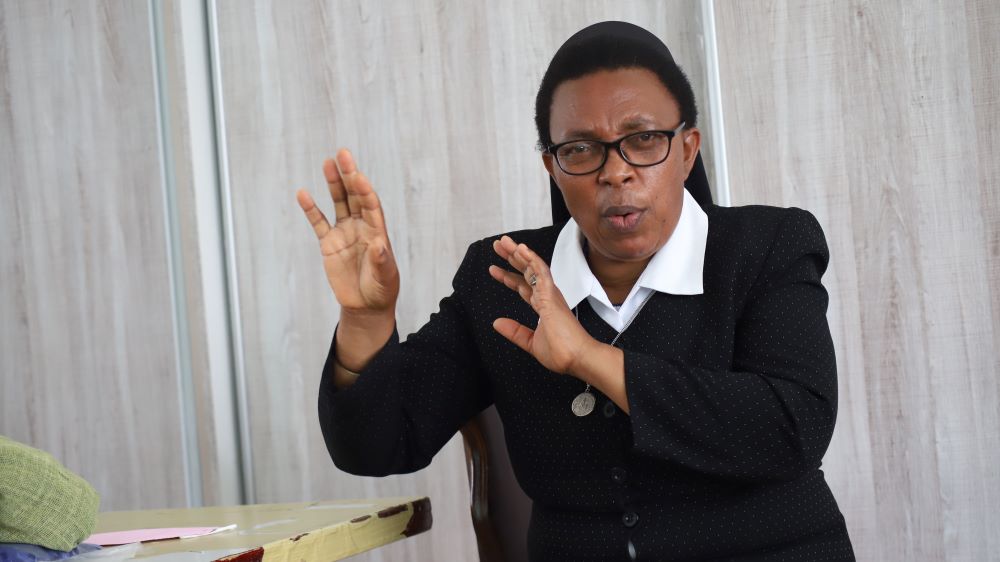 Nun speaking and gesturing