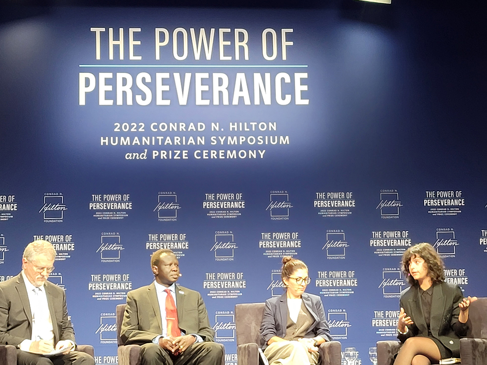 Conrad N. Hilton Foundation president and CEO Peter Laugharn, far left, moderates a panel about refugee resilience. The panel was part of the Oct. 21 Hilton Humanitarian Symposium and Prize Ceremony in Beverly Hills, California. (GSR photo/Gail DeGeorge)