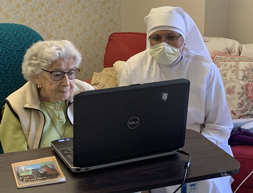 A Little Sister of the Poor helps a resident connect with family in Rhode Island. (Courtesy of the Little Sisters of the Poor)