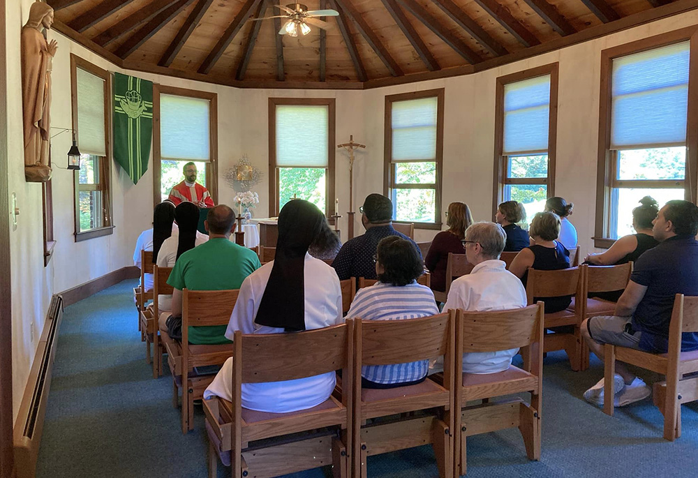 Retreat-goers gather Aug. 24 in the chapel at Sacred Heart on the Lake retreat center in Connecticut. The chapel was designed to match the other buildings on the grounds, which originally held a factory built in 1820. (Courtesy of the Apostles of the Sacred Heart of Jesus)