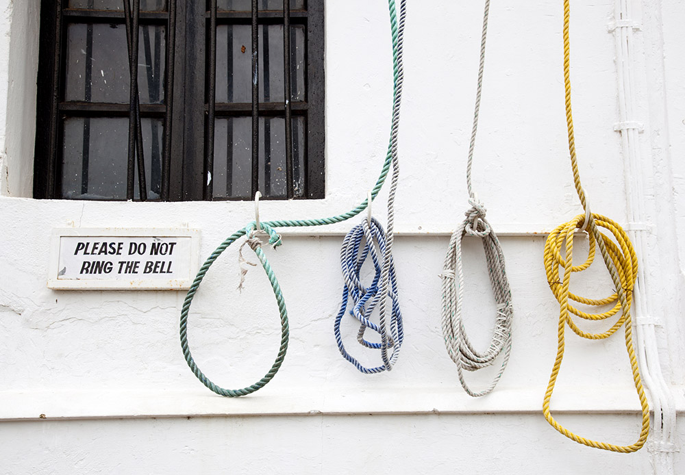 Bell ropes on the wall of a church in India (Dreamstime/Jaume Juncadella)