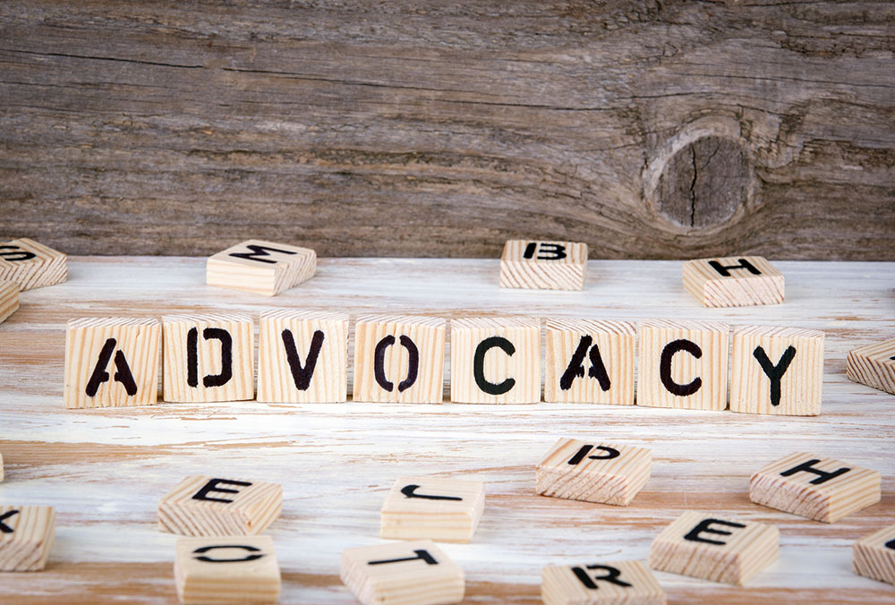 The word "advocacy" in wooden block letters (Dreamstime/Edgars Sermulis)