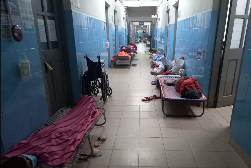 Patients take a rest along the hallway after dialysis in Hue Central Hospital in Vietnam. (GSR photo/Joachim Pham)