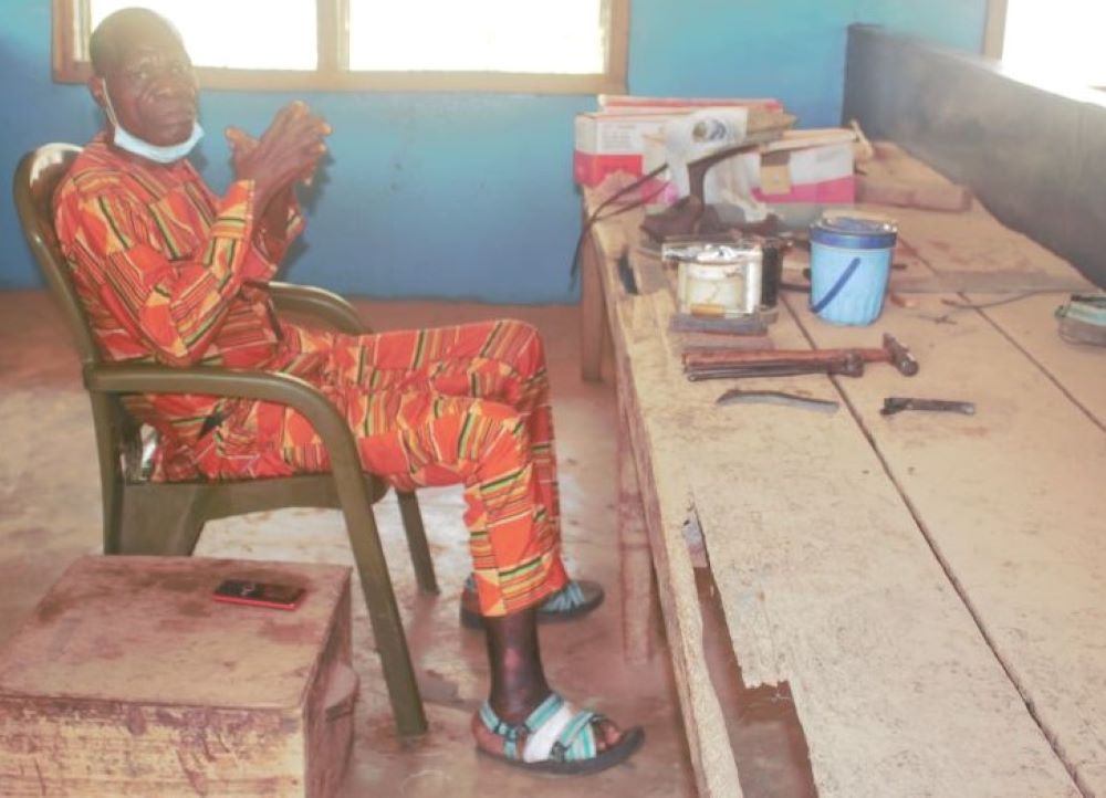 Man sitting at work bench