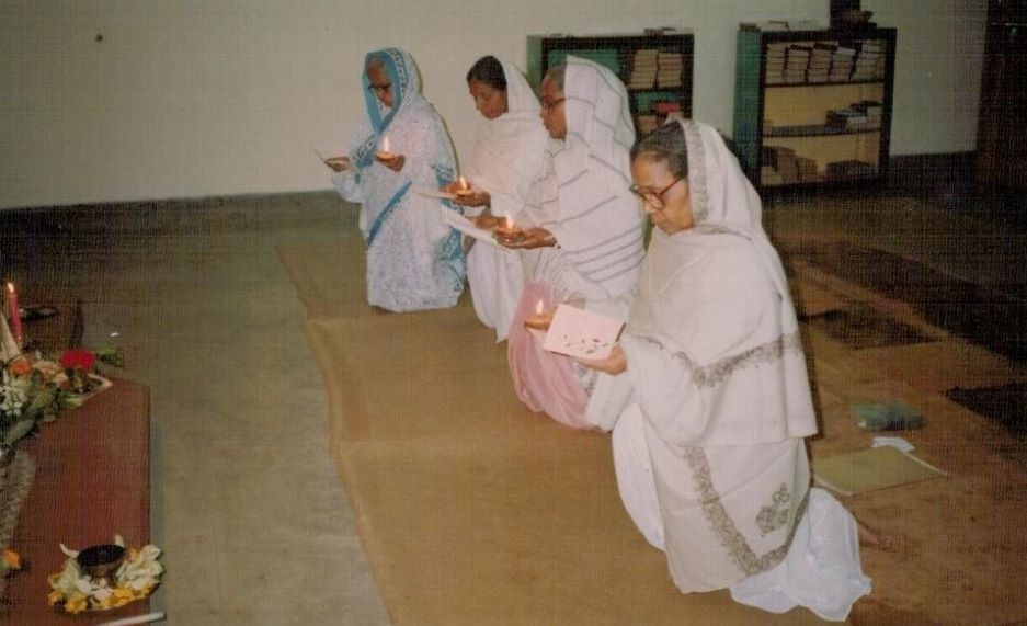 Archbishop Bejoy Nicephorus D'Cruze poses with consecrated virgins and their relatives during the Aug. 27 inauguration of a new prayer house and residence for the virgins at Padrikanda in Golla Parish, Dhaka, Bangladesh. (Sumon Corraya)