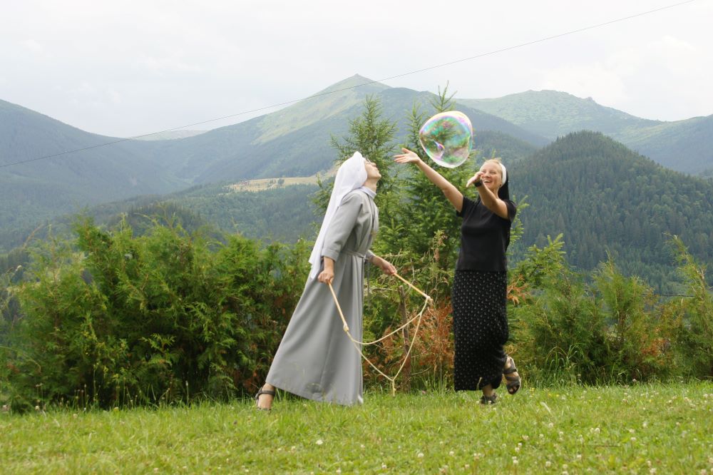 	 1.	Benedictine sisters relax during a meeting in the Ukrainian Carpathian Mountains (Courtesy of Scholastica Oleksandra Hulivata) 