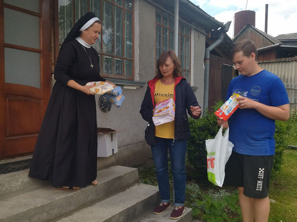 Basilian Sr. Anisiia Voloshyn shares food with those are in need in Voynyliv, Ukraine. (Courtesy of Sisters of the Order of Saint Basil the Great)