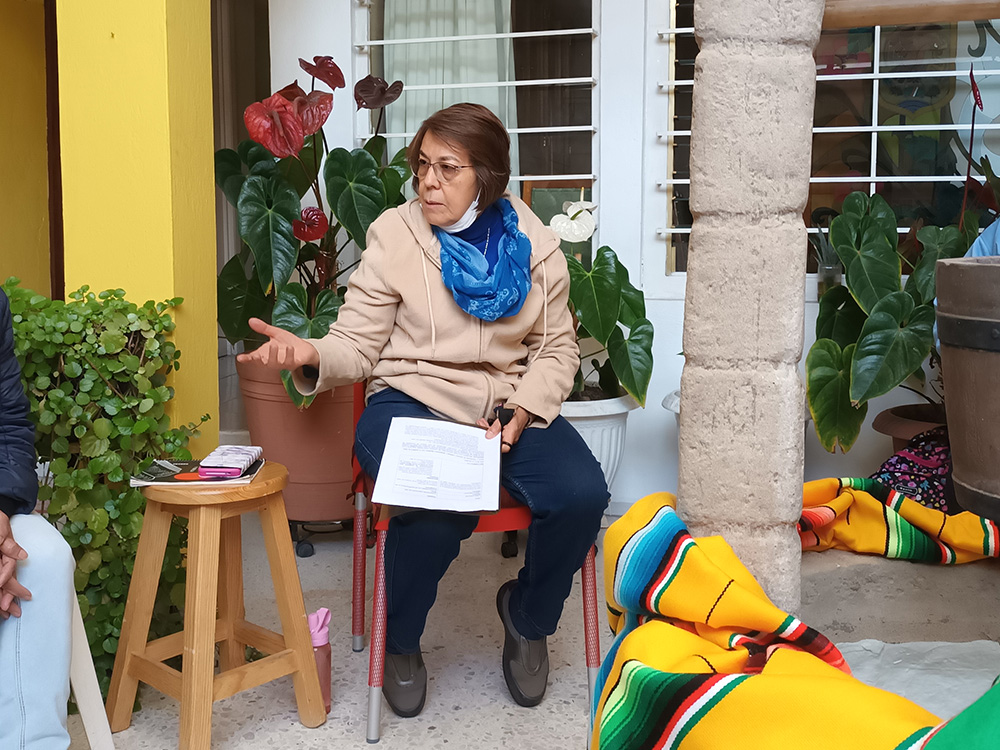 Sr. Manuela Rodríguez gathers the women around the "wishing well" in the garden and shares spiritual formation every Thursday. This October morning, she gave a modern twist to the story of Hagar, the slave of Abraham's wife, Sarah. (GSR photo/Tracy Barnett)
