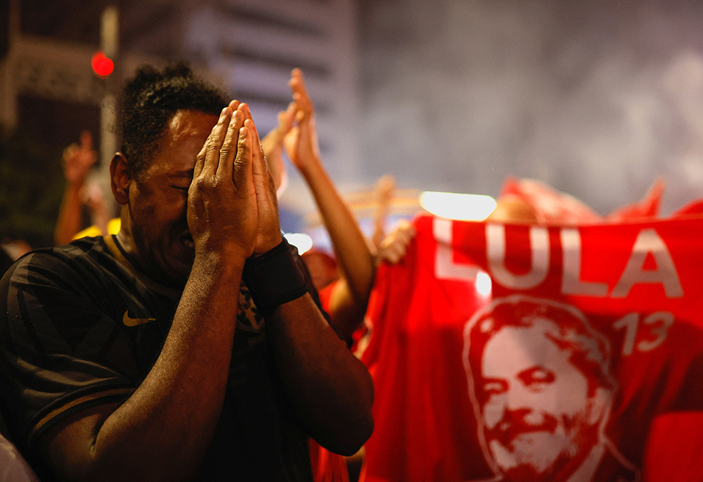 A supporter of Luiz Inácio Lula da Silva reacts as he celebrates election results proclaiming Lula the winner, Oct. 30 in São Paulo, Brazil. (CNS/Reuters/Amanda Perobelli)