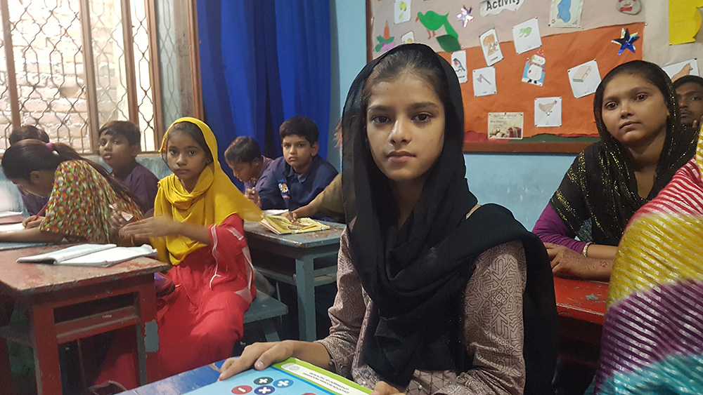 Gypsy students at Soar Primary School in Lahore. Like other non-formal schools, Soar Primary School adopts a multigrade teaching method by teaching a unified syllabus to students from grade one to five, and teenagers in another separate class. (GSR photo/Kamran Chaudhry)