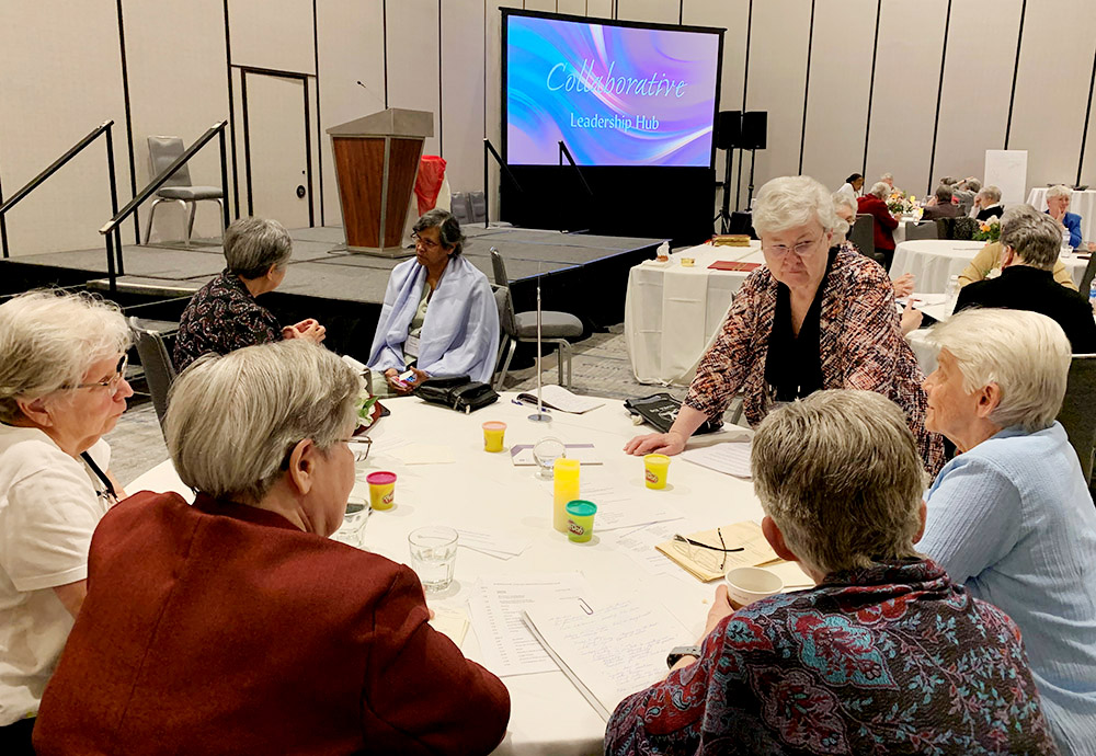 Immaculate Heart of Mary Sr. Anne Munley, standing, associate director of the Leadership Conference of Women Religious' Emerging Life Initiative, facilitates a discussion in Dallas during the summer series of Collaborative Leadership Hubs. (Courtesy of LCWR)