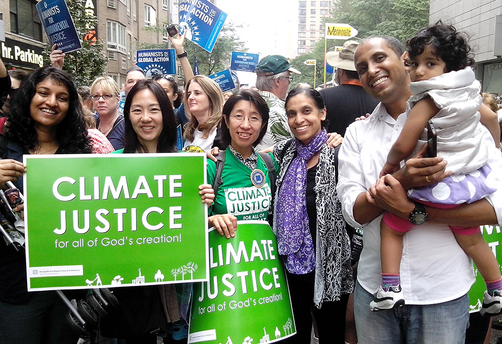 Sr. Celine Paramundayil is pictured, fourth from the left, at a 2014 climate march in New York City. (Courtesy of Celine Paramundayil)