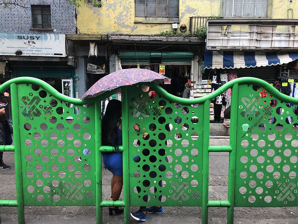 Sex workers in their skin-tight dresses and high heels leaning on the green sidewalk barriers are a common sight along Circunvalación, one of the main thoroughfares through La Merced. (GSR photo/Tracy Barnett)