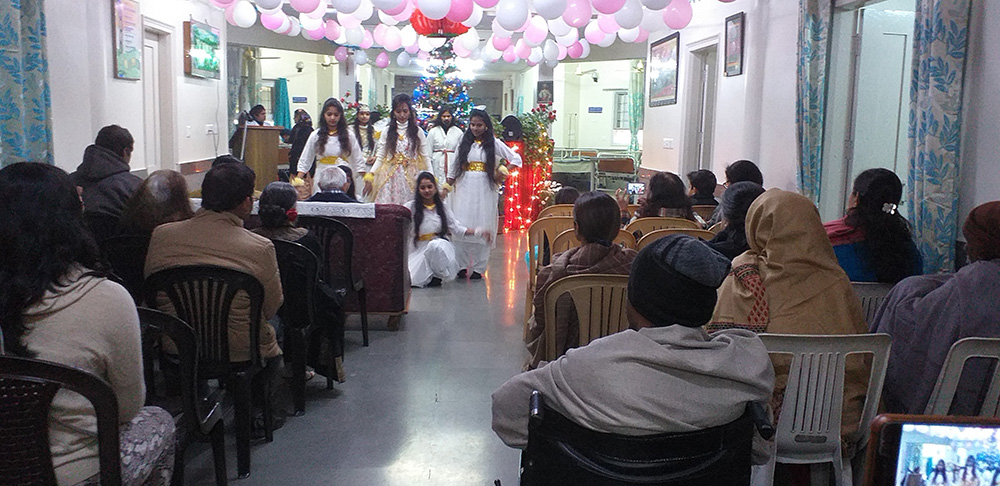 Staff members at Shanti Avedna Sadan, a hospice for terminally ill cancer patients in New Delhi, put on an entertainment program for the patients. (Courtesy of Tabitha Joseph)