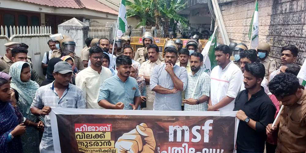 Muslim men protest Sept. 26 in front of Providence Girls Higher Secondary School, Kozhikode, in the southwestern Indian state of Kerala, demanding withdrawal of a ban on wearing the hijab in classrooms. The school is managed by the Apostolic Carmel congregation. (S. Kumar)