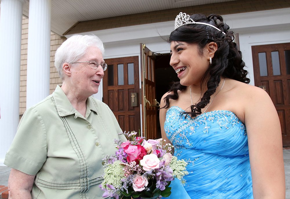 Sr. Margaret Smyth with a young woman celebrating her quinceanera