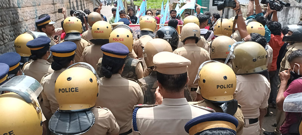 Police block the entry of Muslim protesters into the campus of Providence Girls Higher Secondary School, Kozhikode, a town in the southwestern Indian state of Kerala. The Muslims insist on allowing female students to wear a hijab in the classroom. (S. Kumar)
