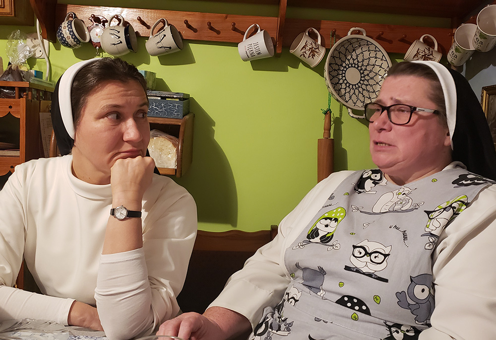 Polish Dominican Srs. Margaret Lekan, left, and Mateusza Trynda, the local superior of a convent of four Polish sisters in Zhovkva, Ukraine, during a meal at the convent (GSR photo/Chris Herlinger)