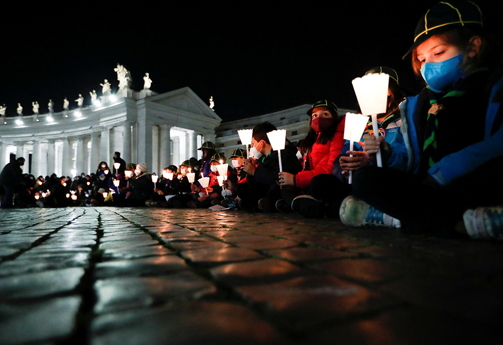 People gather to pray for peace in Ukraine March 2 in St. Peter's Square at the Vatican. (CNS/Reuters/Remo Casilli) People gather to pray for peace in Ukraine March 2 in St. Peter's Square at the Vatican. (CNS/Reuters/Remo Casilli)