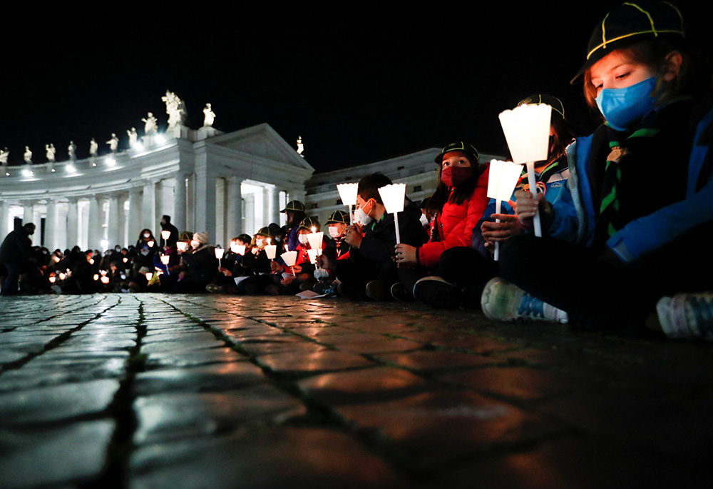 People gather to pray for peace in Ukraine March 2 in St. Peter's Square at the Vatican. (CNS/Reuters/Remo Casilli)