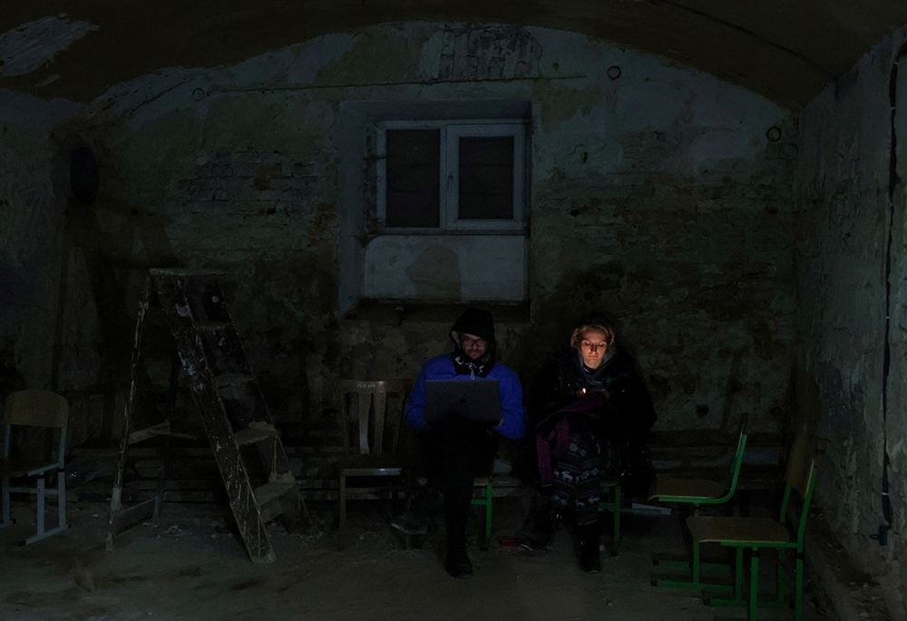 People in Lviv, Ukraine, take shelter in the basement of a school March 3 amid Russia's invasion of Ukraine. (CNS/Reuters/Kai Pfaffenbach)