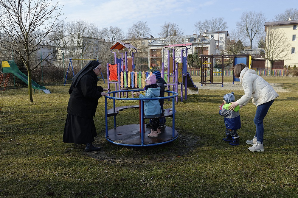 Sister Zuzanna plays with the children of Olga, a Ukrainian refugee, at a kindergarten run by the Missionary Sisters of the Holy Family in Lublin, Poland, on March 17. Thousands of refugees from Ukraine have been assisted by and are living with communitie