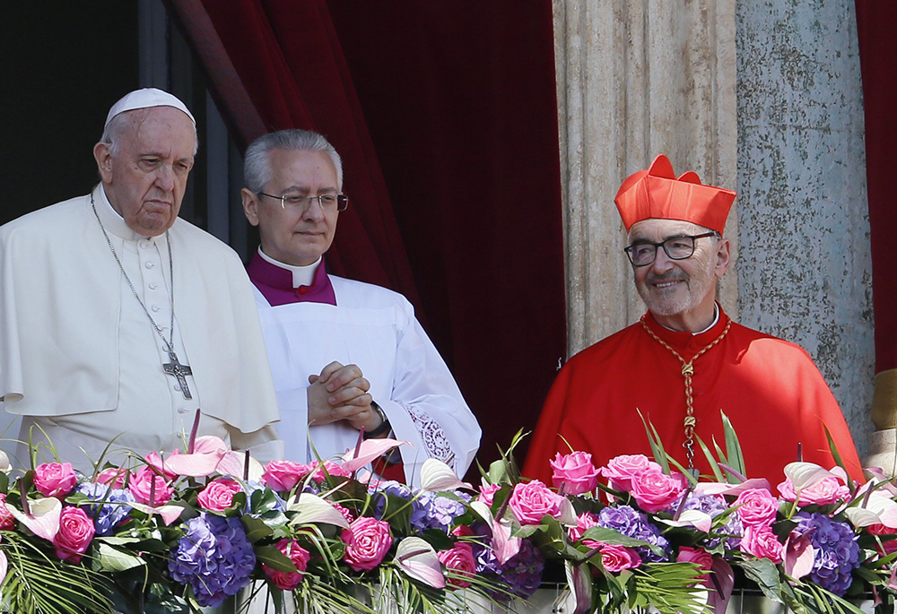 Cardinal Michael Czerny looks on as Pope Francis delivers his Easter message and blessing "urbi et orbi" (to the city and the world) from the central balcony of St. Peter's Basilica at the Vatican April 17. (CNS/Paul Haring)