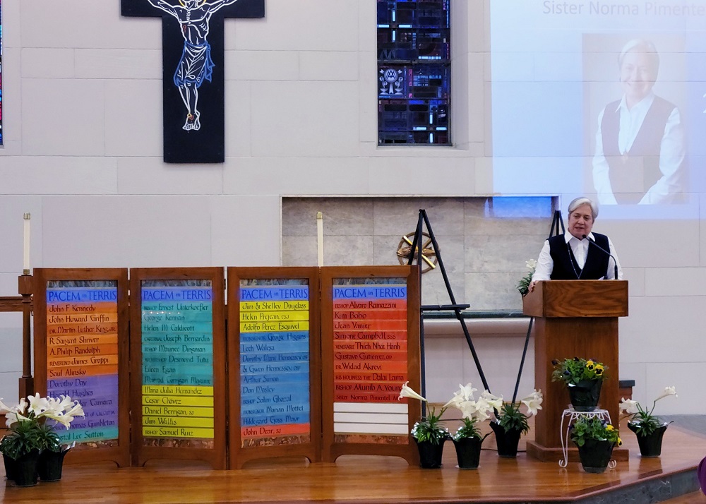 Sr. Norma Pimentel, director of Catholic Charities of the Rio Grande Valley in Texas, speaks about her work at the U.S.-Mexico border after receiving the Pacem in Terris Peace and Freedom Award on April 21 in Christ the King Chapel at St. Ambrose Universi