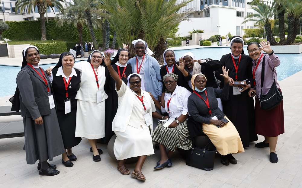 Nuns take a photo during a break May 3 as superiors of women's religious orders meet for the plenary assembly of the International Union of Superior Generals in Rome. (CNS/Paul Haring)