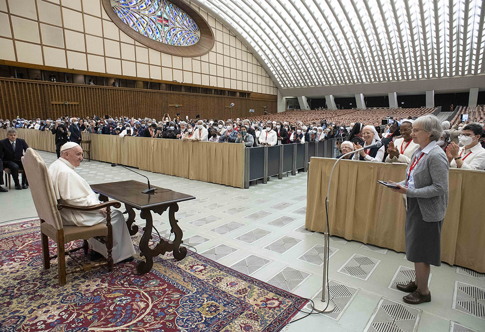 Pope Francis listens as Claretian Missionary Sr. Jolanta Kafka, president of the International Union of Superiors General, speaks during a May 5 audience with participants in the plenary assembly of the UISG at the Vatican. (CNS/Vatican Media)