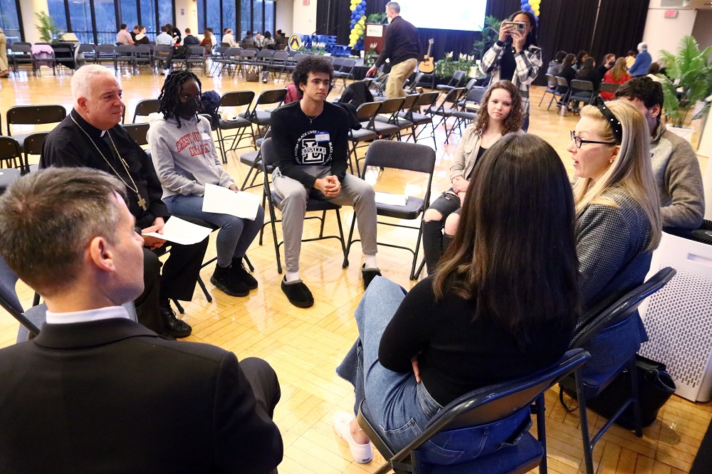 Philadelphia Archbishop Nelson Pérez joins college students, other young adults and ministry leaders during an April 4 synodal listening session at La Salle University. (CNS/CatholicPhilly.com/Sarah Webb)