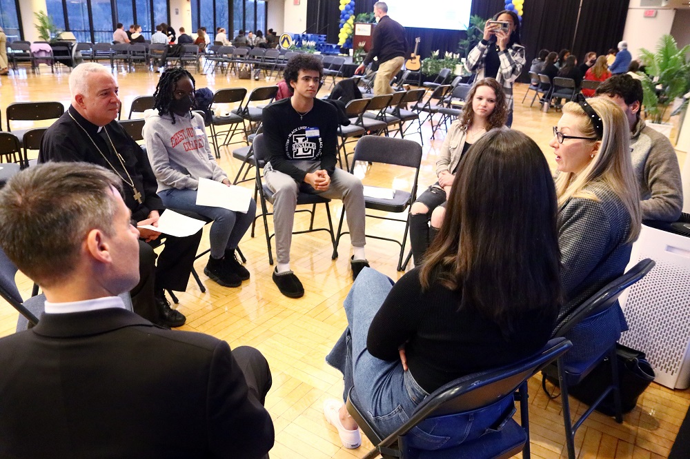 Philadelphia Archbishop Nelson Pérez joins college students, other young adults and ministry leaders during an April 4 synodal listening session at La Salle University. (CNS/CatholicPhilly.com/Sarah Webb)