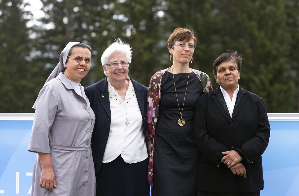 Leaders of the International Union of Superiors General and the Global Solidarity Fund are pictured May 23, 2022, at the World Economic Forum in Davos, Switzerland. From left, Sr. Ruth del Pilar Mora, a Colombian who worked in Ethiopia for years; Sr. Patricia Murray, of the Sisters of Blessed Mary, Virgin of Loreto, executive secretary of the UISG; Marta Guglielmetti, executive director of the Global Solidarity Fund; and Sr. Mary John Kudiyiruppil, Servant of the Holy Spirit missionary from India and UISG a