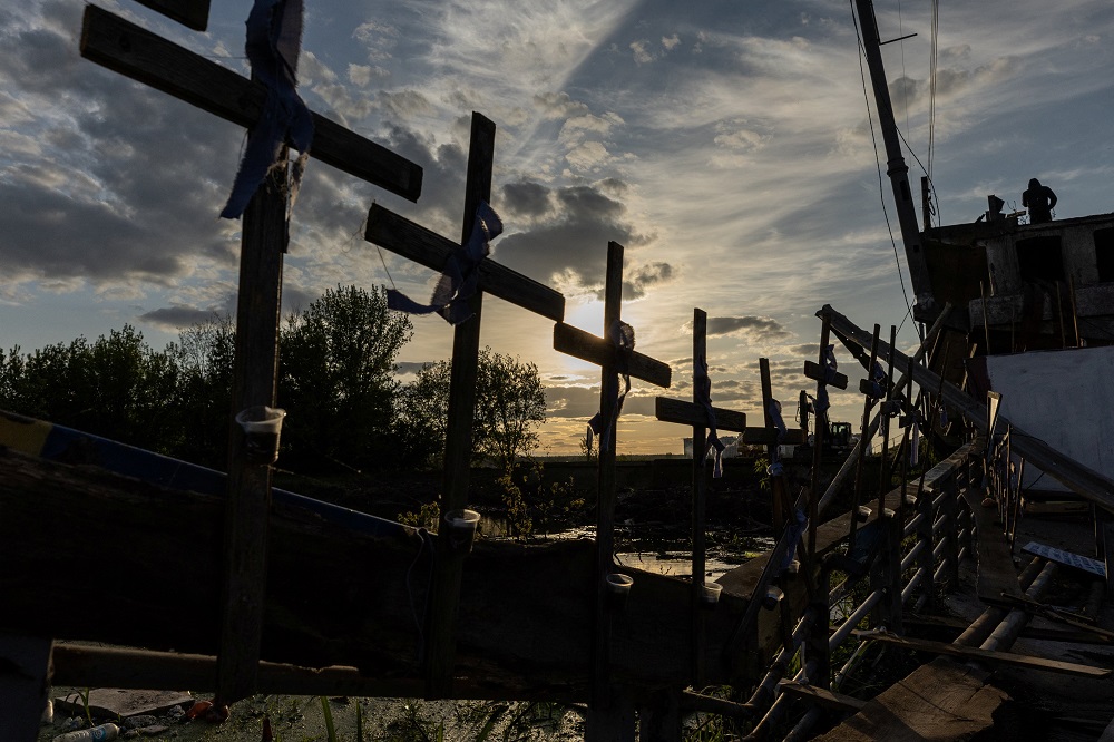Crosses attached to a destroyed bridge in Irpin, Ukraine, on May 16 (CNS/Reuters/Jorge Silva)