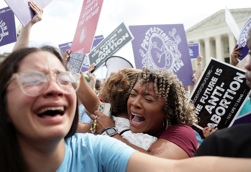Pro-life demonstrators in Washington celebrate outside the Supreme Court June 24 as the court overruled the landmark Roe v. Wade abortion decision in its ruling in the Dobbs case on a Mississippi law banning most abortions after 15 weeks. (CNS/Reuters/Eve