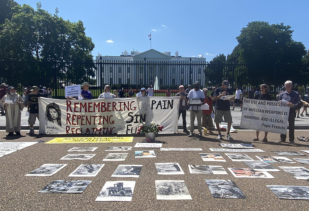 Members of several Catholic organizations gather in front of the White House Aug. 9, to pray for peace on the 77th anniversary of U.S. bombing of Nagasaki, Japan. (CNS/Rhina Guidos)