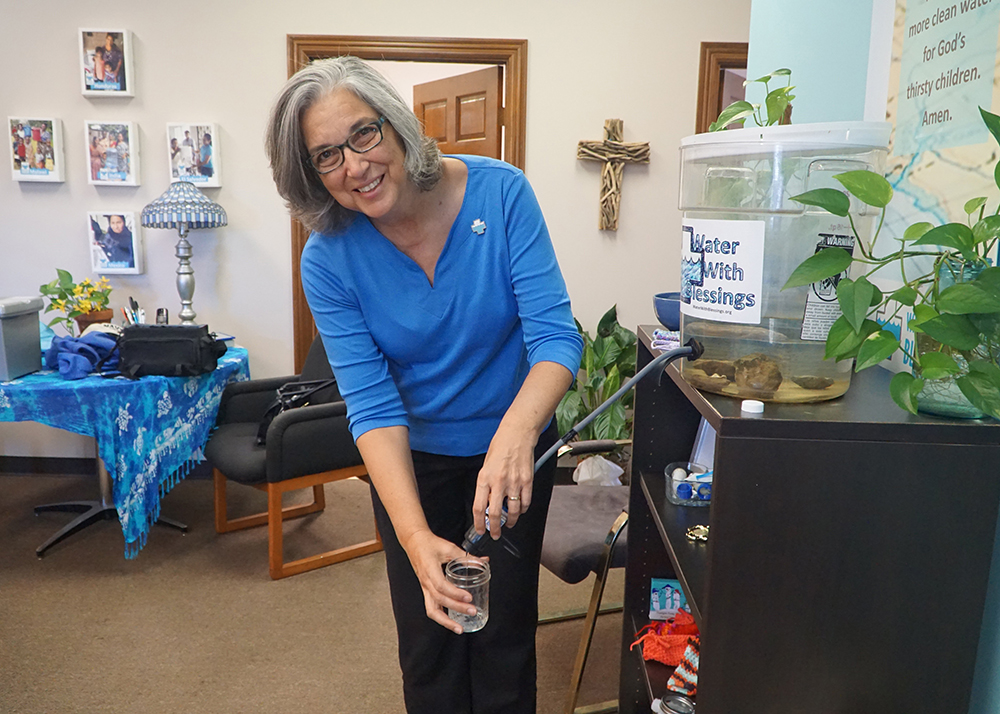 Sr. Larraine Lauter, an Ursuline Sister of Mount St. Joseph, Kentucky, demonstrates the use of a Sawyer PointOne filter in the Water With Blessings office in Middletown, Kentucky, on Sept. 12, 2019. (CNS/The Record/Ruby Thomas)