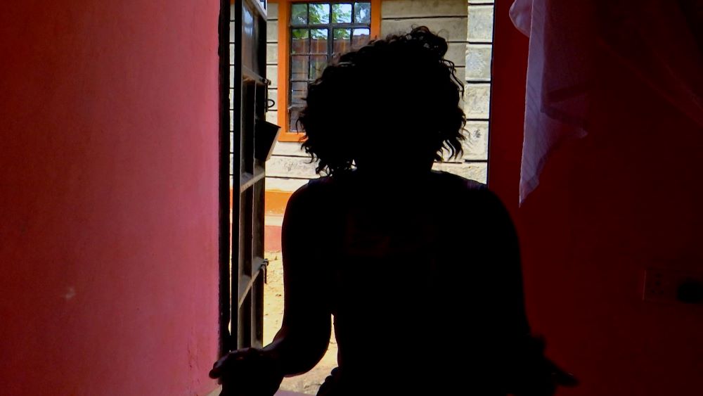 Silhouette of woman in doorway