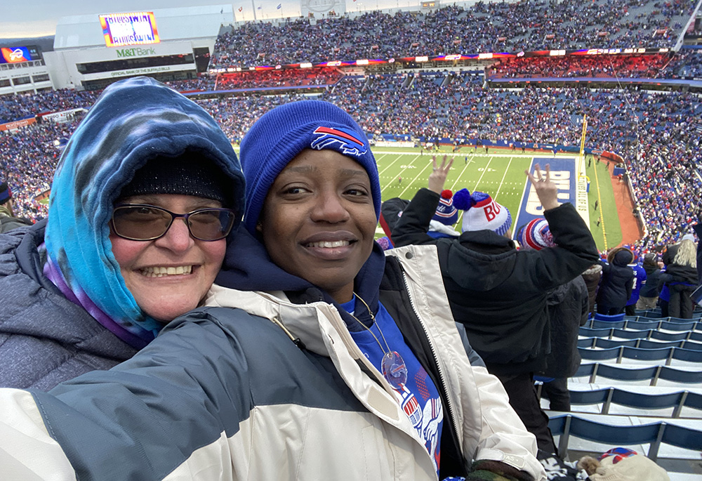 Jennifer Wilson and her friend Alex enjoy a moment of joy in 2023 at a Buffalo Bills football game. (Courtesy of Jennifer Wilson)