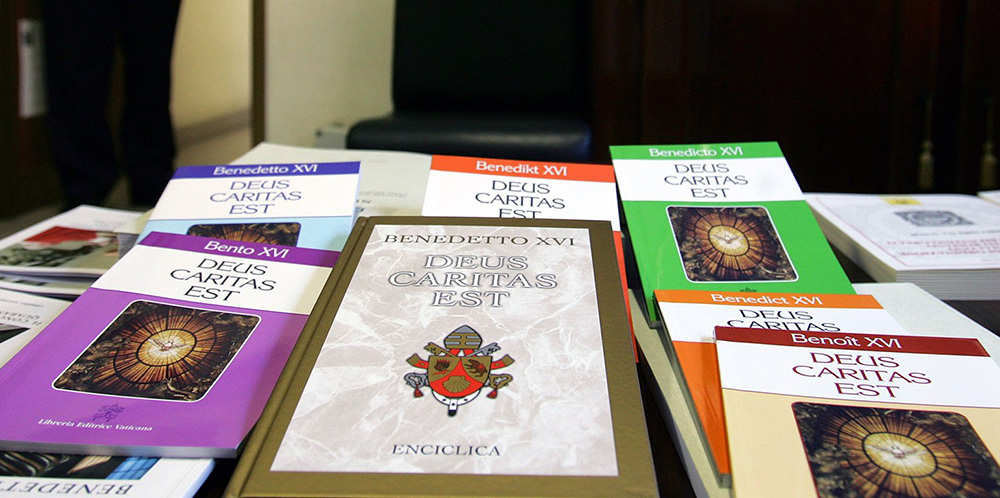 Pope Benedict XVI's first encyclical, Deus Caritas Est ("God Is Love") is seen in various languages in the Libreria Editrice Vaticana publishing house Feb. 2, 2006. (CNS/Catholic Press Photo/Alessia Giuliani)