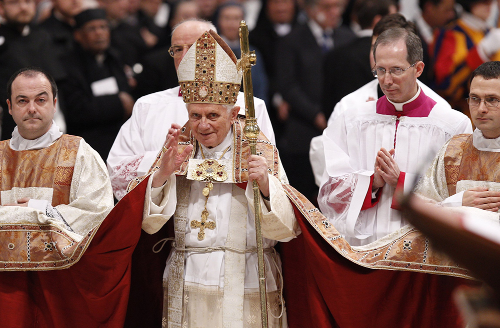 Pope Benedict XVI waves as he leaves after celebrating vespers with members of religious orders in St. Peter's Basilica at the Vatican on Feb. 2, 2011, the feast of the Presentation of the Lord and the World Day for Consecrated Life. (CNS/Paul Haring)